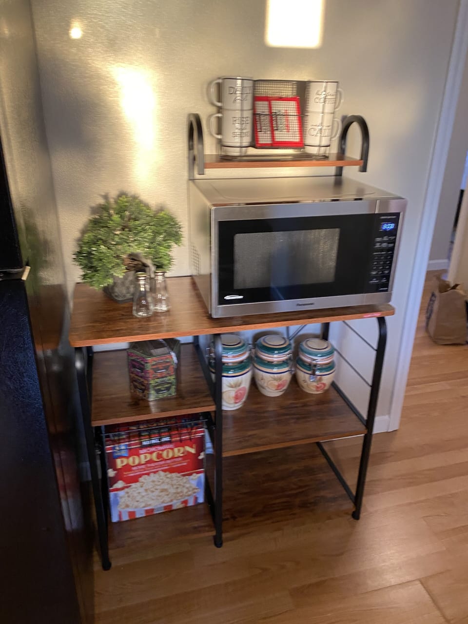 Microwave and coffee bar with complimentary coffee, tea and popcorn.