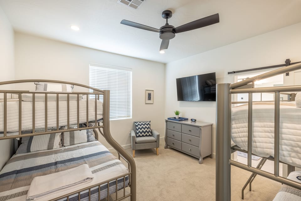 Bedroom 3 - Bedroom 3 is a large bedroom which includes a Twin over Double bunk bed, Twin over Twin bunk bed, a private bathroom, and TV.