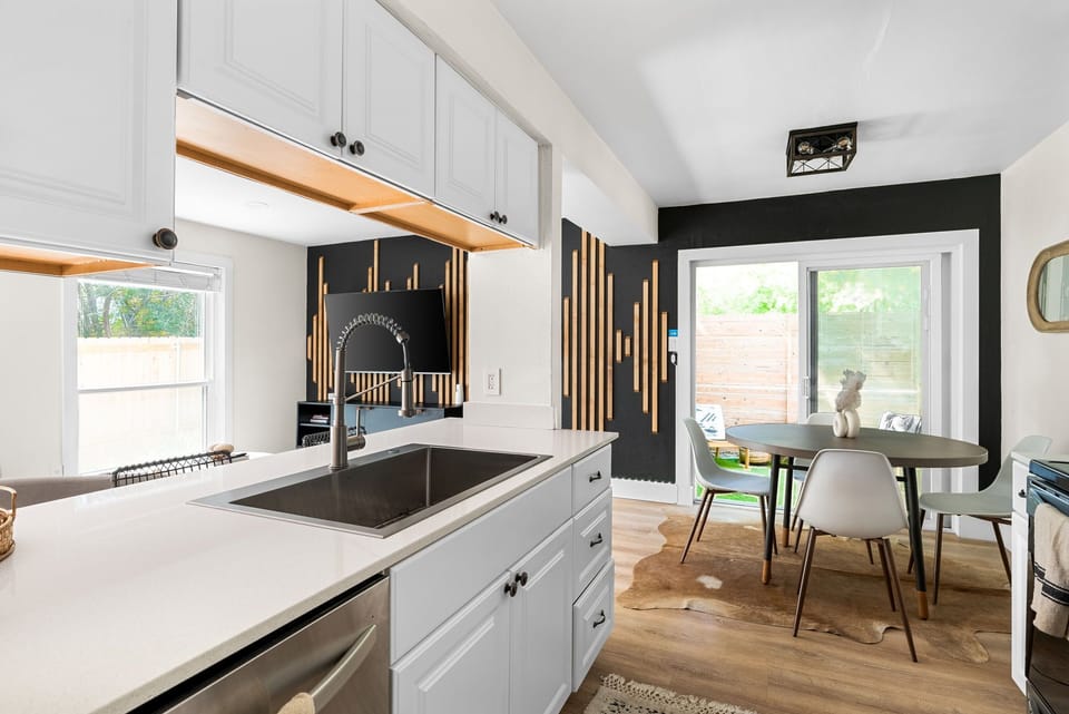 The countertop in a kitchen with white cabinets can act as a focal point and complement the overall design.