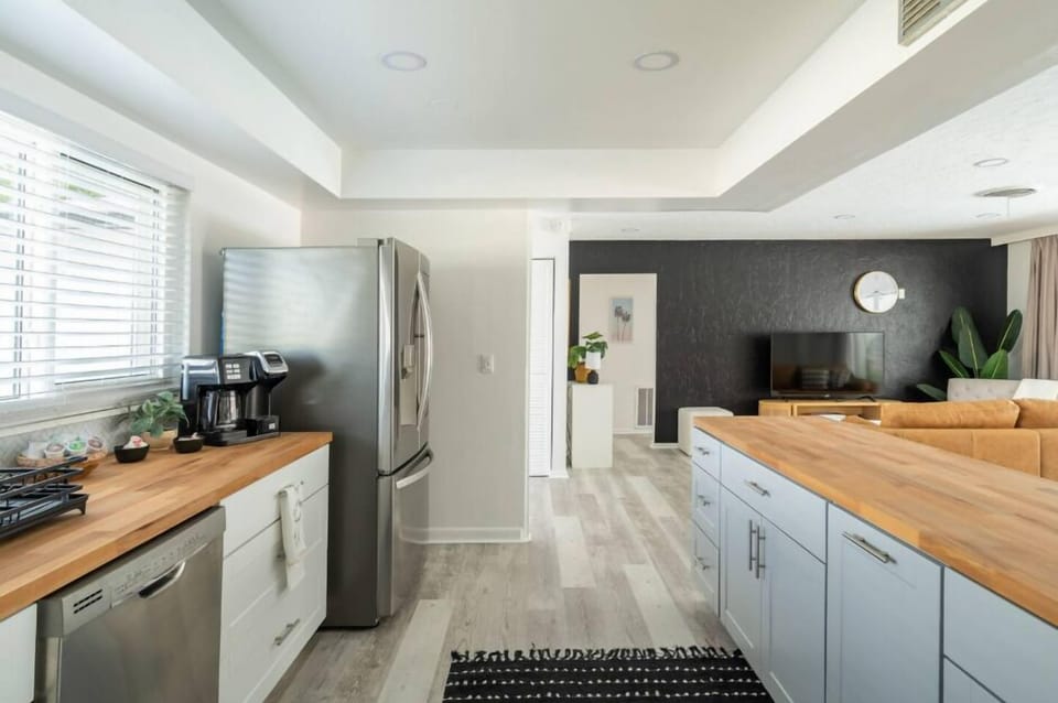 Modern appliances including a fridge, dishwasher, electric stove, and more!