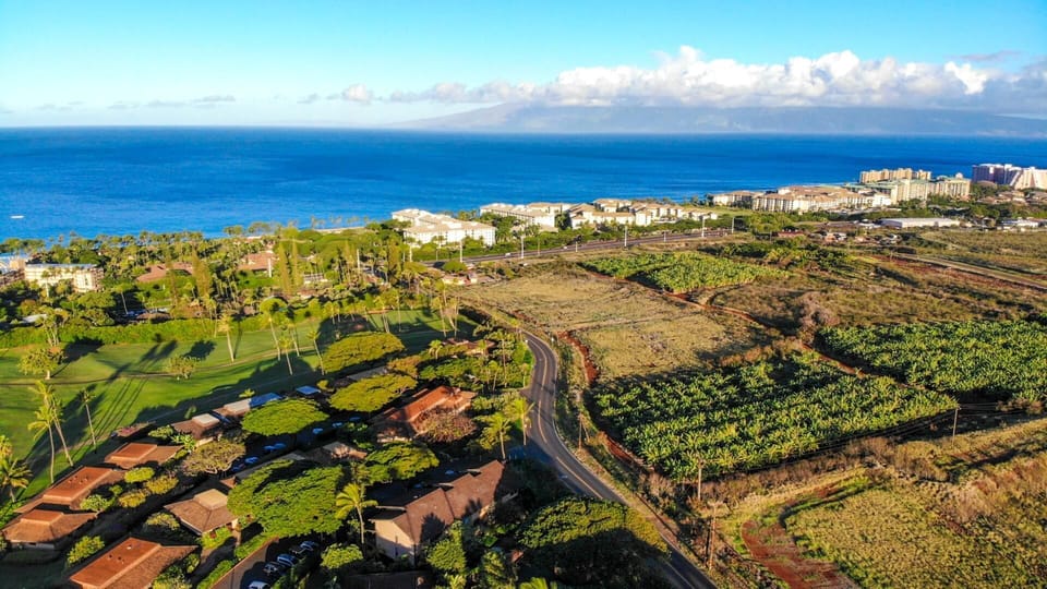 Spectacular aerial of Wailea?s premier coastal properties with emerald greens, azure waters & endless skies