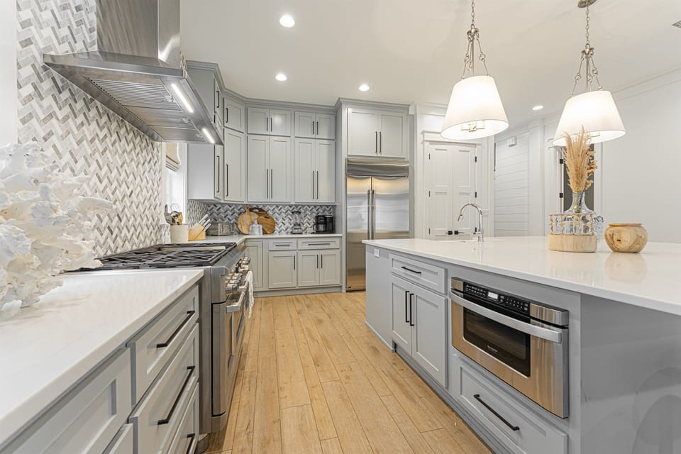 Gourmet Kitchen. Island Seating for 6. Double Ovens. 6 Burner Stove with Griddle, Microwave, Dishwasher, and More.