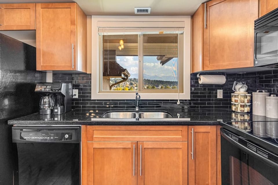 Full kitchen with a drip coffee machine, ground coffee, tea, sugar and basic condiments (ketchup, mustard and relish.)
