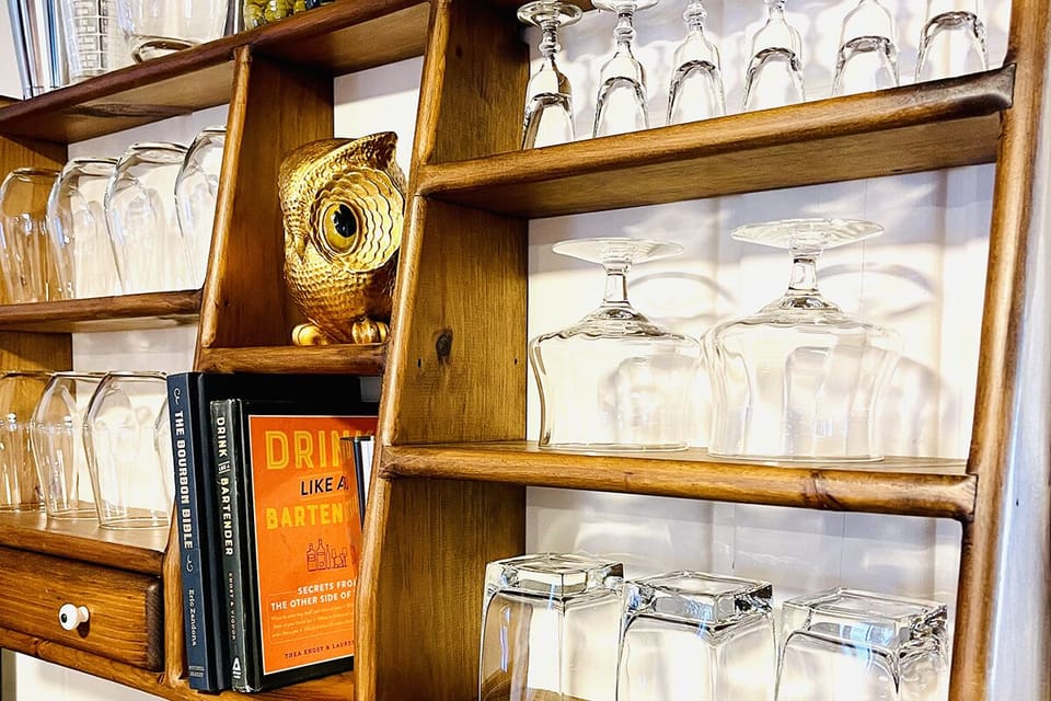 The beverage center has a variety of glassware, including wine, rocks, snifters, aperitif, & champagne glasses.