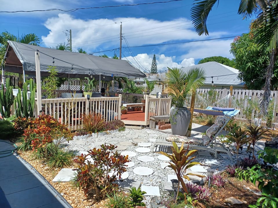 back yard covered deck gas grill hammock tropical gardens fenced in locked gates