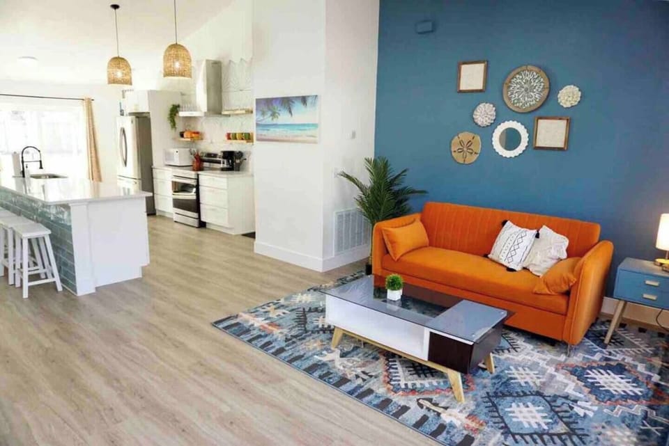 Living room: Our home boasts an open layout where you can sit and lounge by the couch or eat by the dining table or just mingle while preparing for dinner. It’s a personal favorite too!