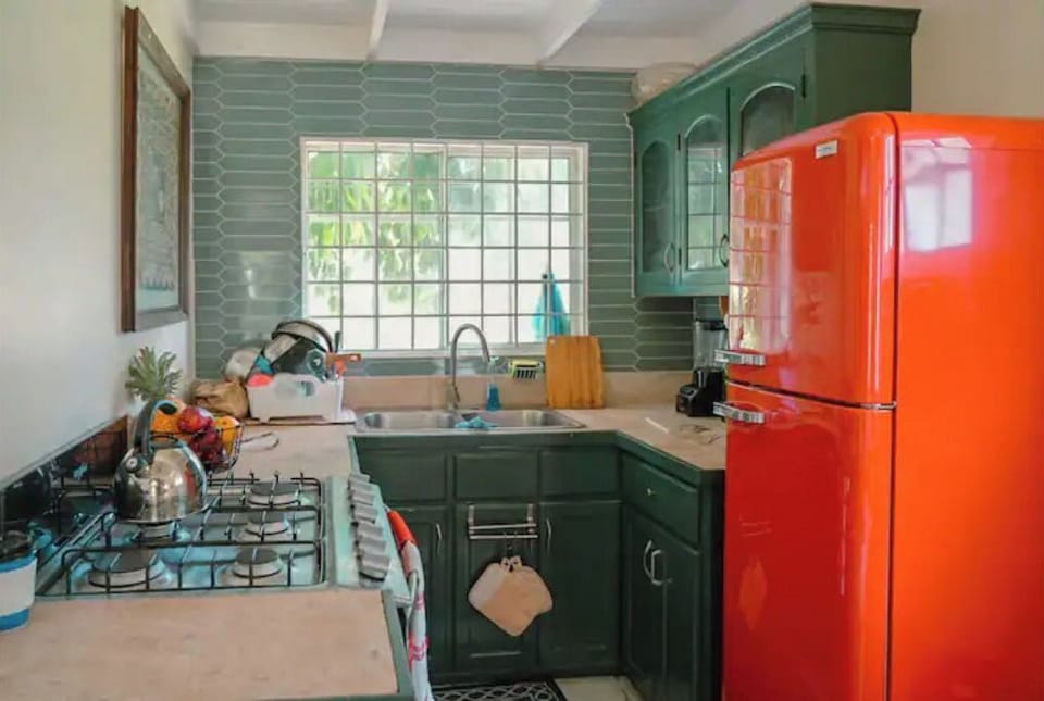 Fully stocked kitchen with stove and appliances