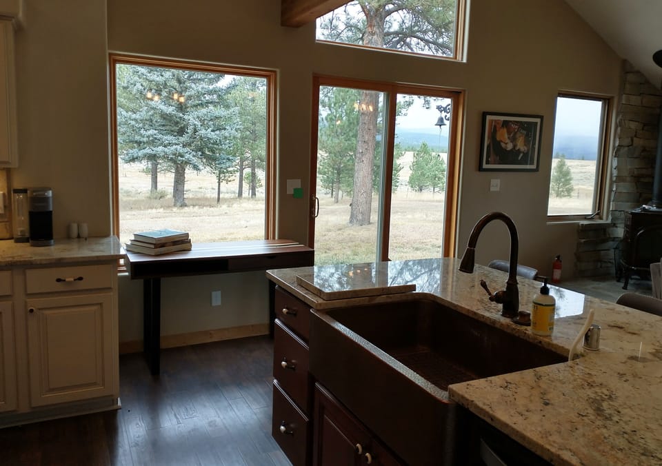 Windows in great room let you enjoy the beautiful views