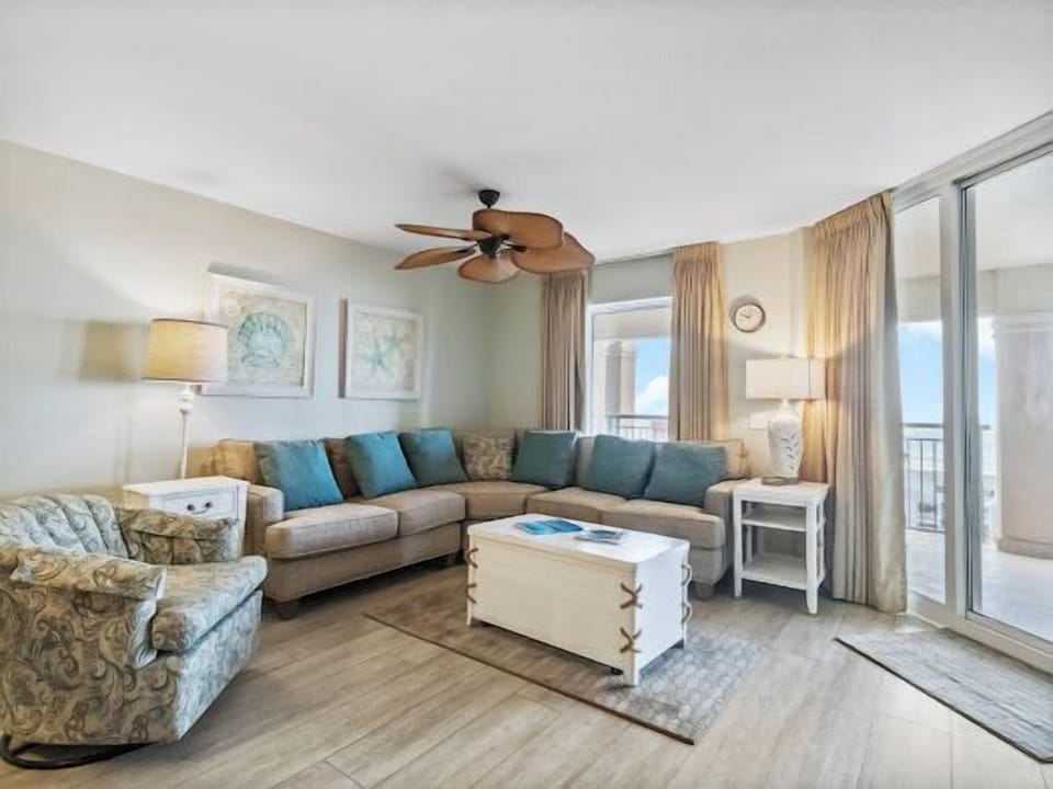Sink into plush sectional seating with ocean breezes flowing through your bright, coastal-inspired living space.