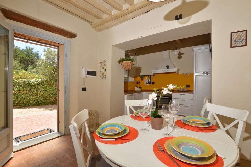 The living-dining room with the kitchen corner
