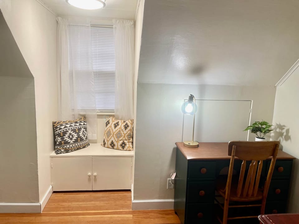 Upstairs queen room: desk and lamp with air unit