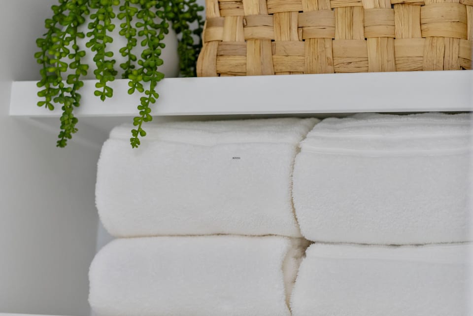 Hotel-quality towels & black makeup towels provided for every stay.