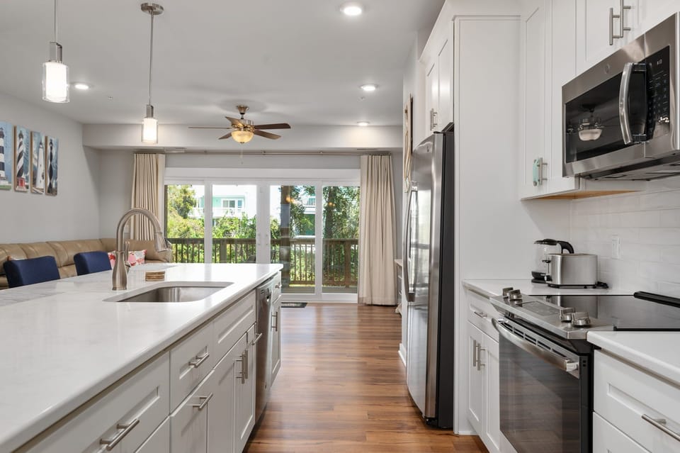 Kitchen Area with Bar Stool Seating on Second Level