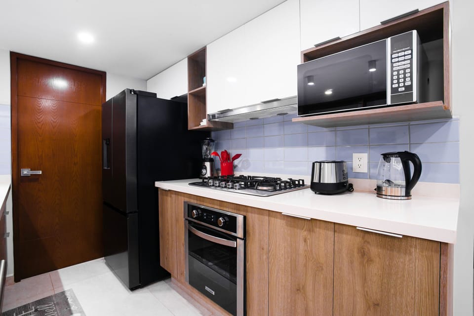 Kitchen amenities include a full-size refrigerator, stove, oven and dishwasher