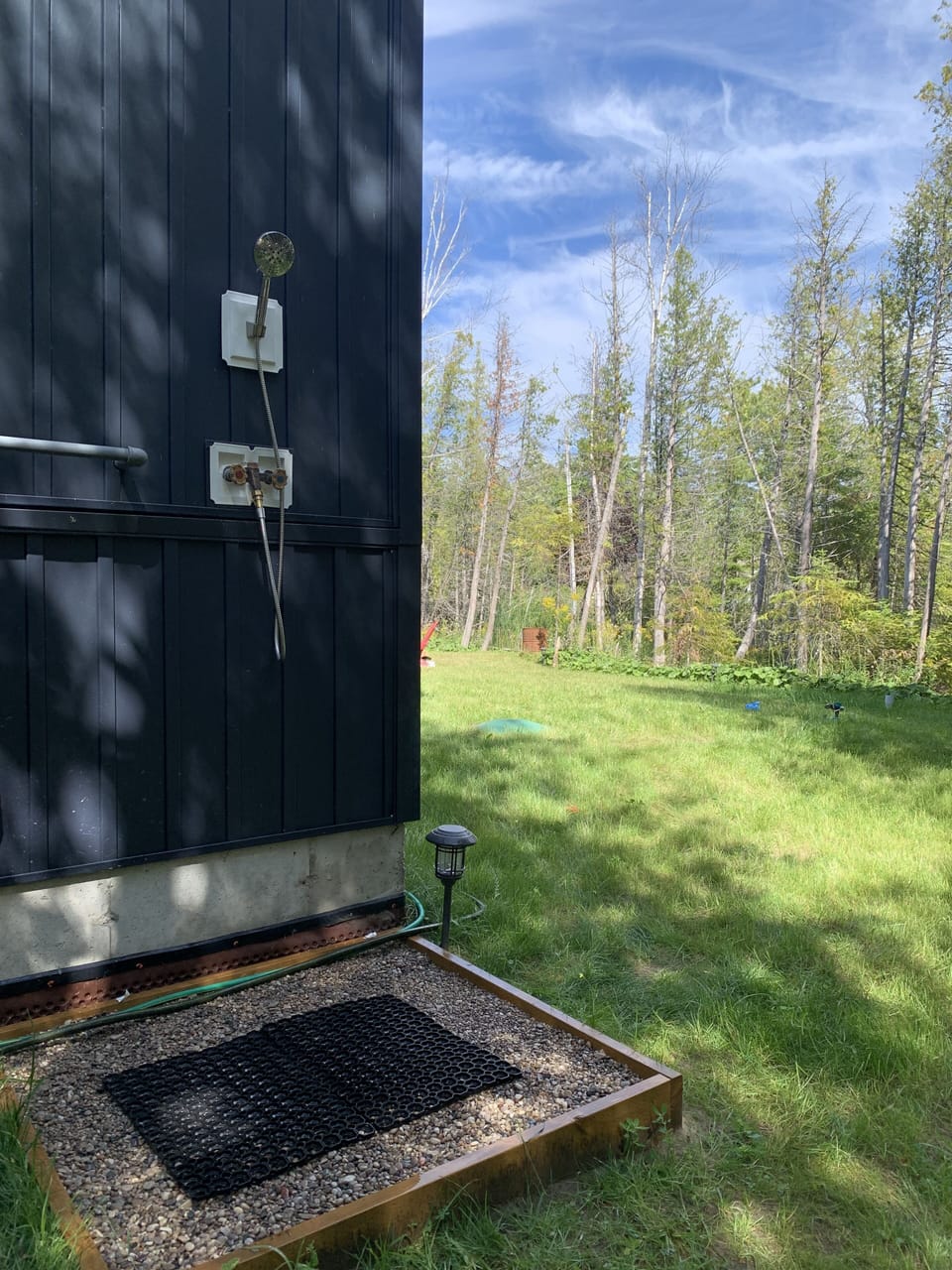 Outdoor shower area, for rinsing yourself off after a lovely day at the beach.