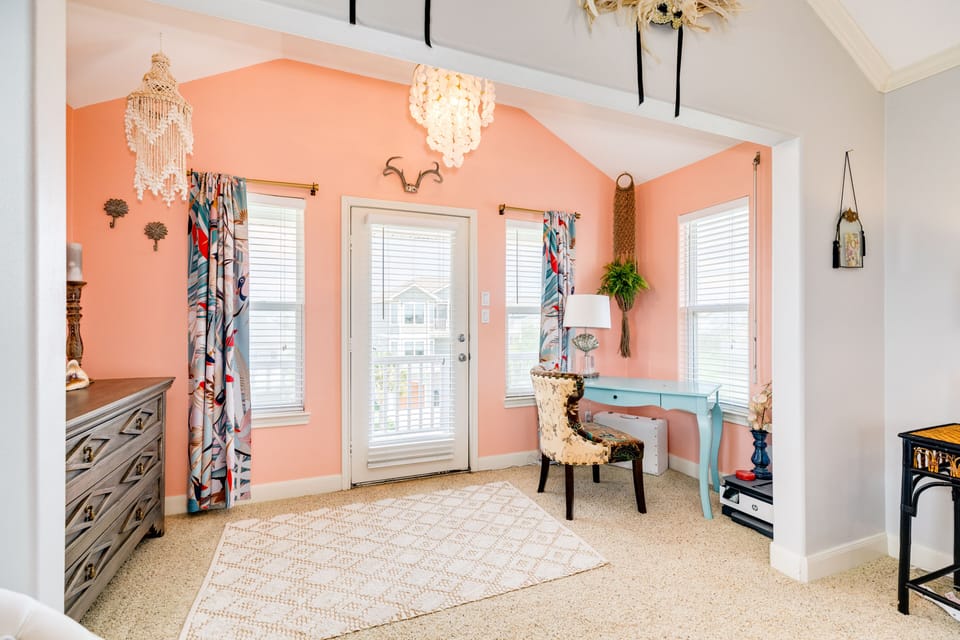 Desk area in primary suite leads to the private deck