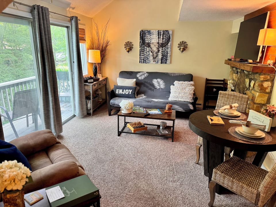LR overlooks bumbling stream below. HD TV, cathedral ceilings & pure comfort.