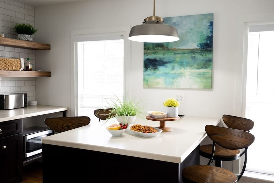 Upon arrival you will find an assortment of continental style breakfast offerings for you to enjoy. The kitchen island is the perfect place to enjoy your morning coffee. (Food items pictured vary during stay. Displayed for photo purposes only)
