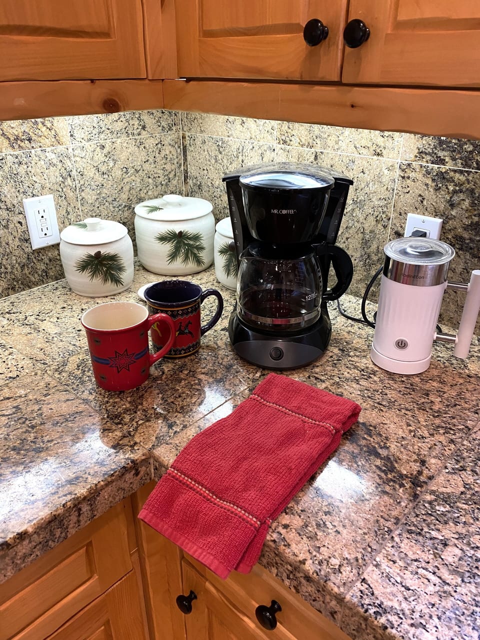 Mr. Coffee, filters, coffee, sugar and mugs for morning brew