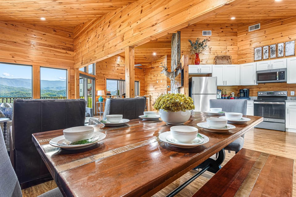 Gather and dine in style at our table for 8, with a folding table and chairs to seat 4 more. The open floor plan seamlessly connects the dining area to the living room and kitchen, providing not just a meal but a joyous, shared mountain experience.