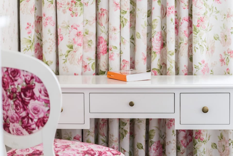 The bedroom's design is both stylish and functional. 