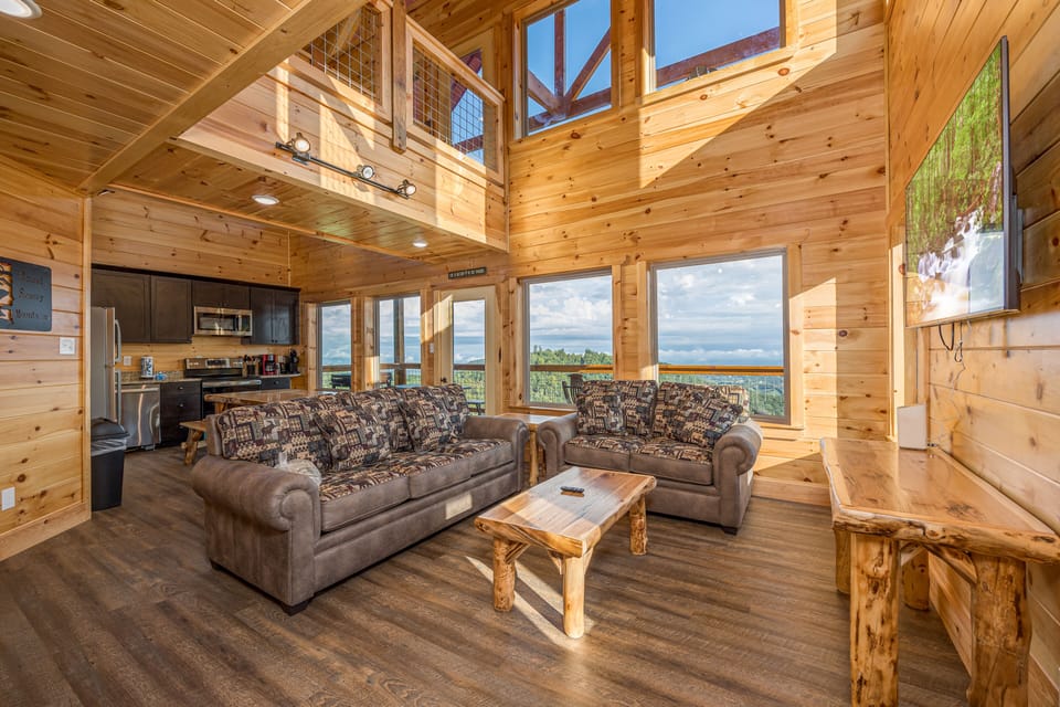 Living room to open concept kitchen, several open and clear window to see the mountain/valley view
