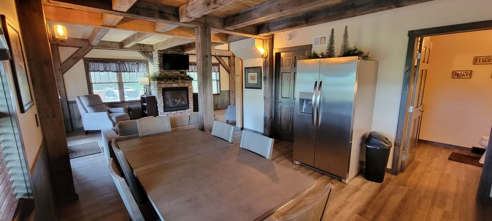 Dining Area with modern refrigerator and Dining Table, seats 6.