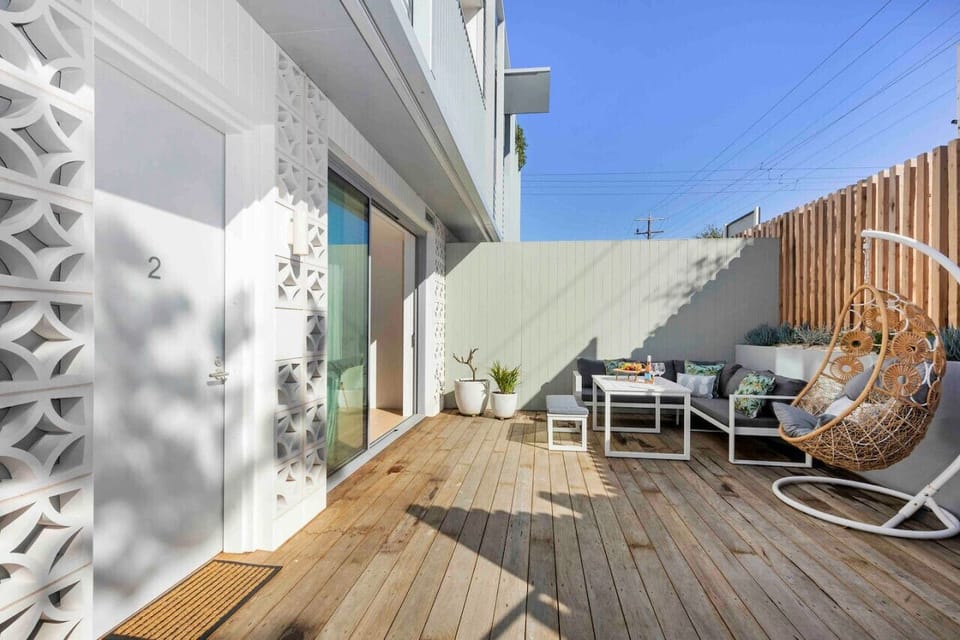 🌞 Private outdoor patio with seating and a relaxing sunlit deck