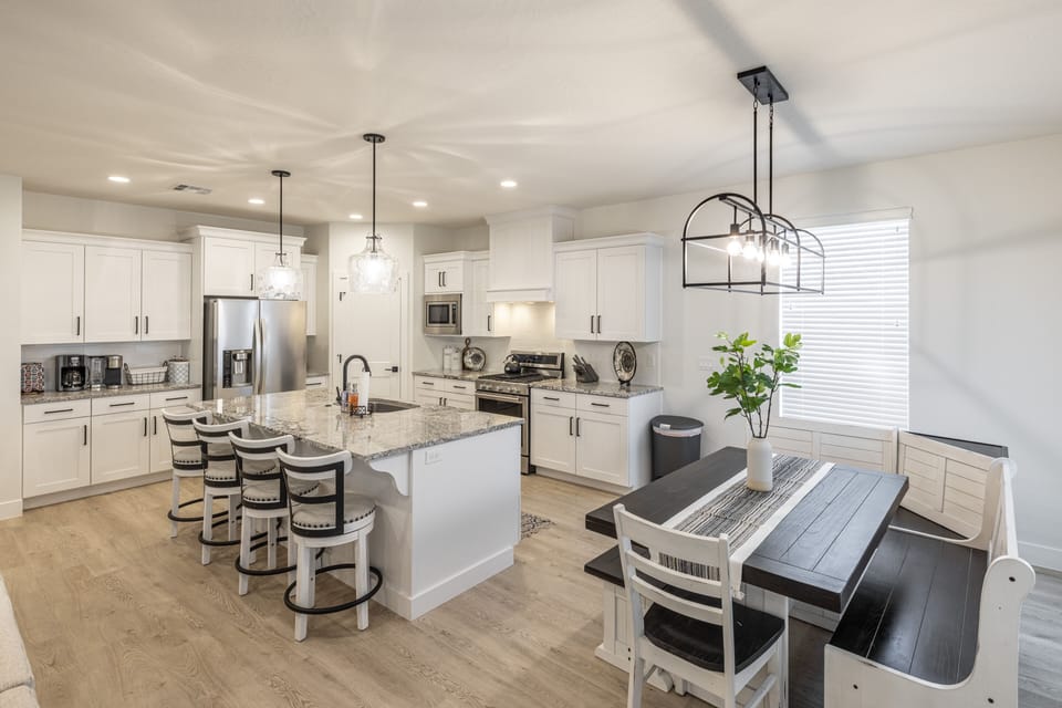 Dining Table & Kitchen Island - With an open and spacious floor plan, the Dining Room and Kitchen can accommodate meal preparations for groups large or small.