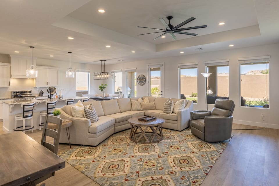 Living Room View - The living room is designed as an open floor plan and is a great gathering place for meals, games, or watching TV during your stay.