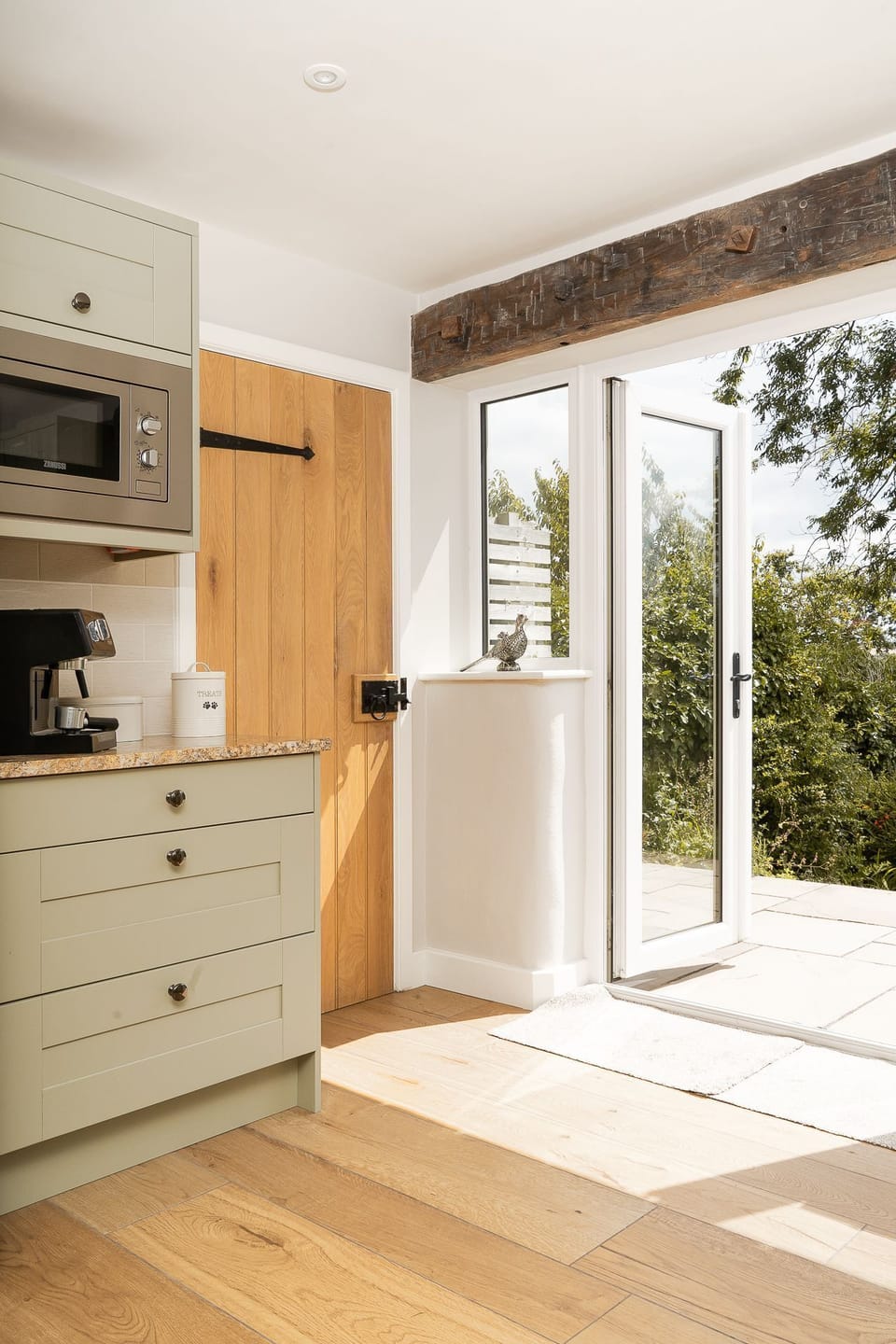 The kitchen with patio doors at Daydreamer Cottage, Cornwall