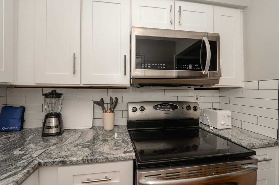Our spacious kitchen is a chef’s dream—ample counter space, full appliances, and everything you need to whip up culinary delights.