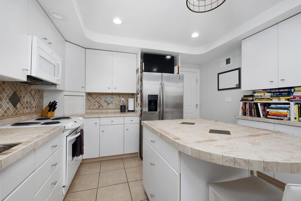 Show off your cooking skills in your bright & energetic kitchen w/ smart TV.