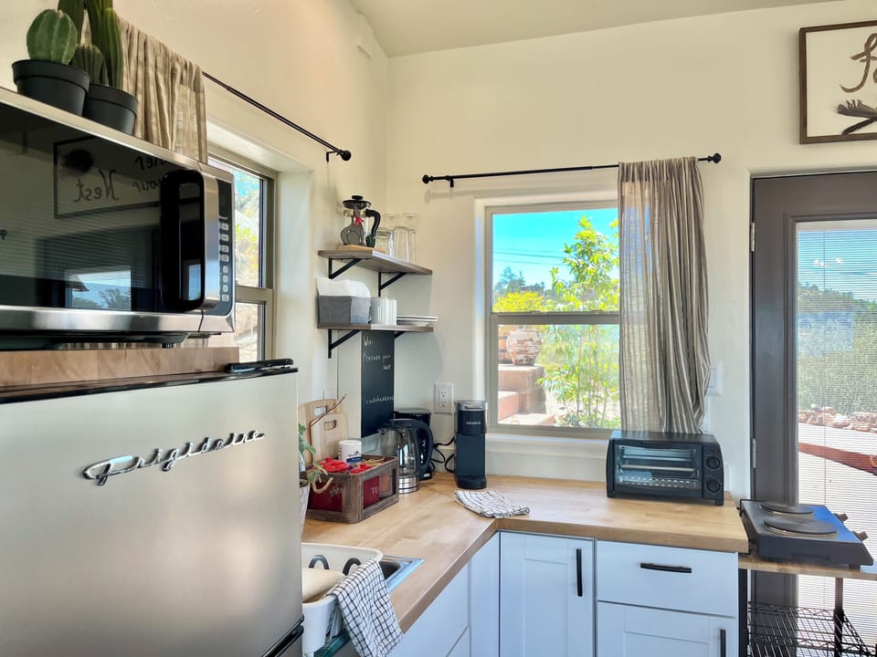 Pots/pans, utensils, knives, mixing bowls, cutting boards for light meal prep.
