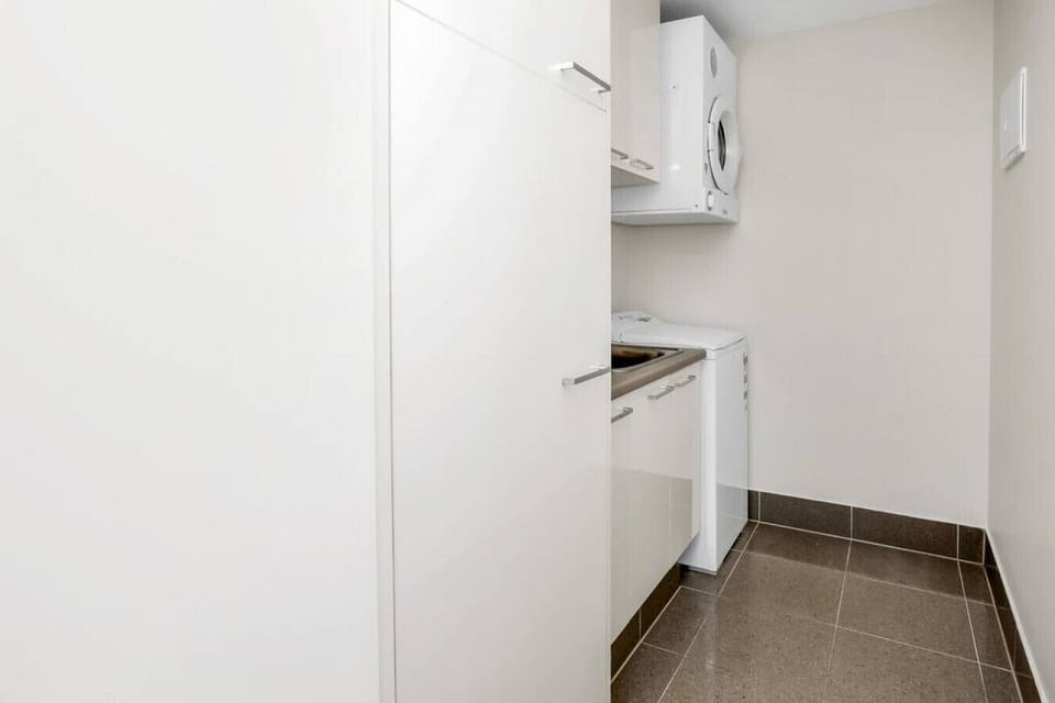Convenience meets practicality in the separate internal laundry room, equipped with a washing machine, dryer, iron, and ironing board. With all the essentials provided, it`s easy to take care of your laundry during your stay, ensuring you have everything 