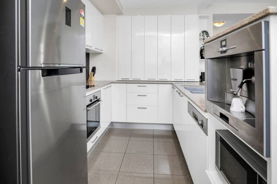 Fully equipped modern kitchen with quality appliances, ready for home-cooked meals.