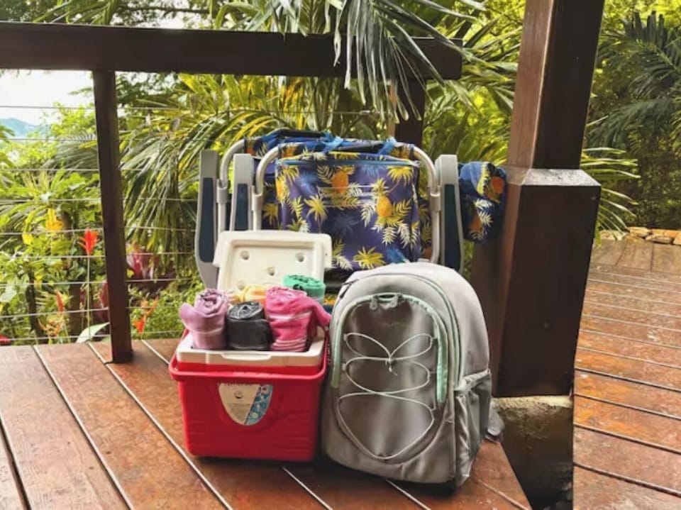 Beach gear such as chairs, cooler, backpack, and towels