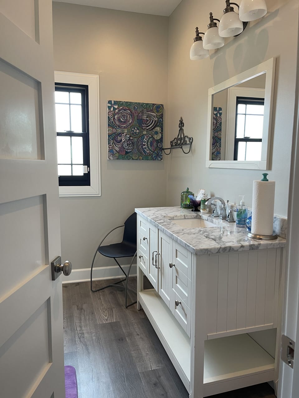 Large bathroom with tub, shower, and a giant mirror for makeup time.