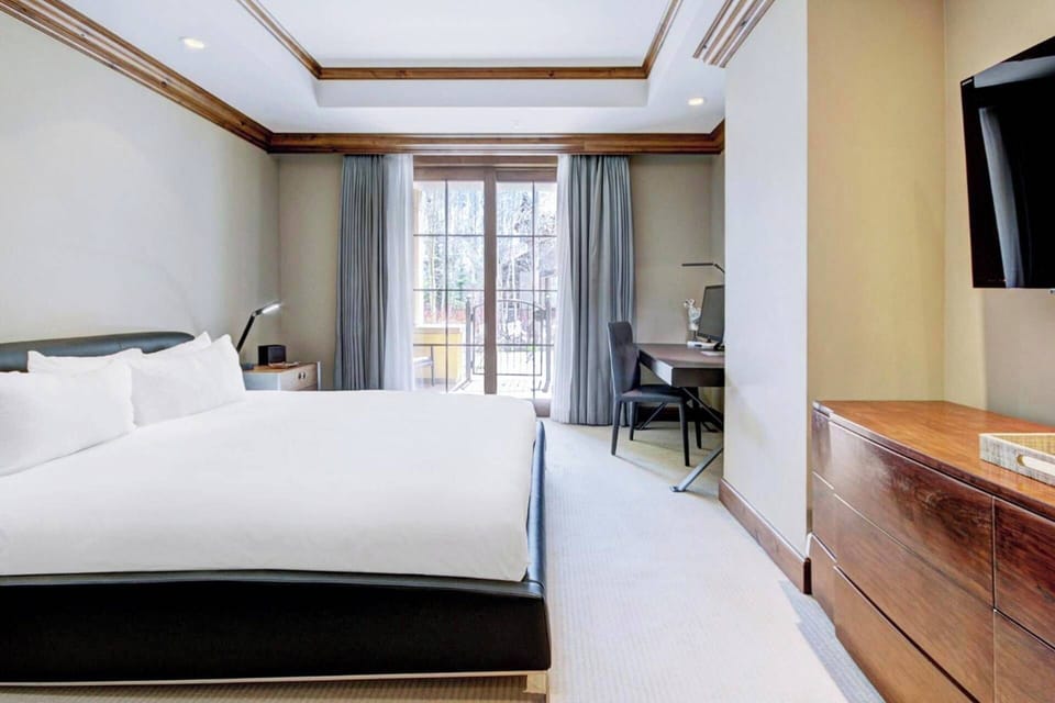 Primary Bedroom features a king bed, walk-in closet, desk, and ensuite bathroom.