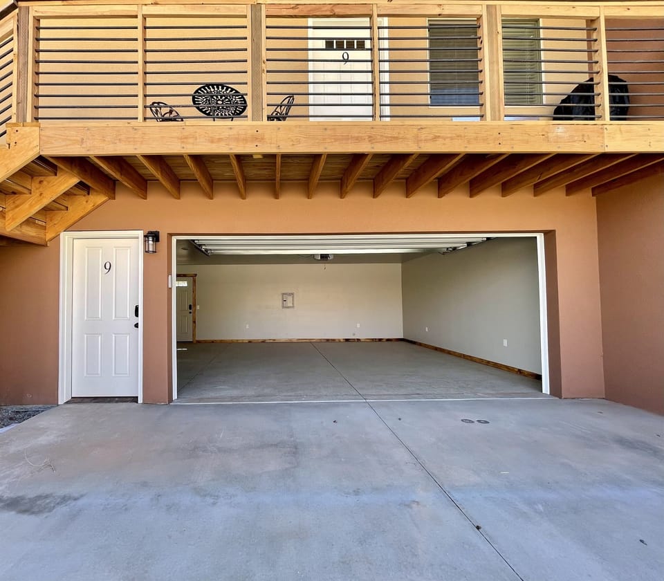 Sits over a garage.  Must climb stairs