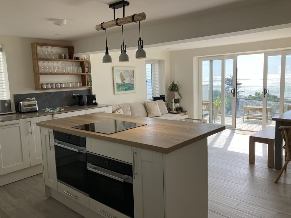 Kitchen area with island and 2 ovens