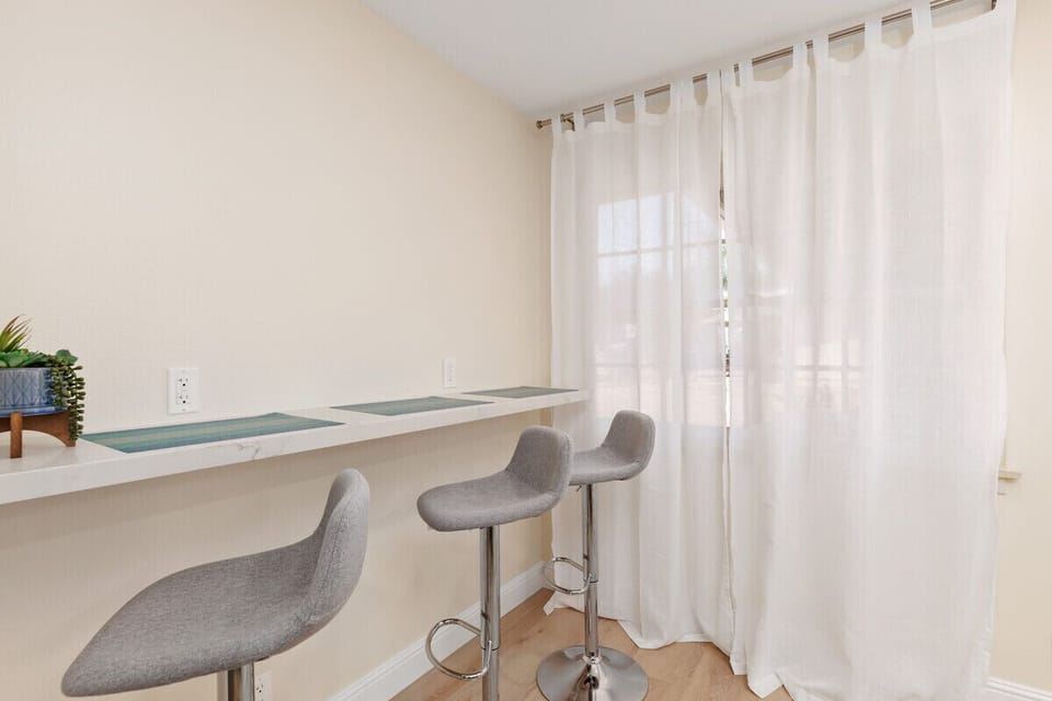 Bar seating - perfect for drinks or quick meals. Wireless charger + speaker.