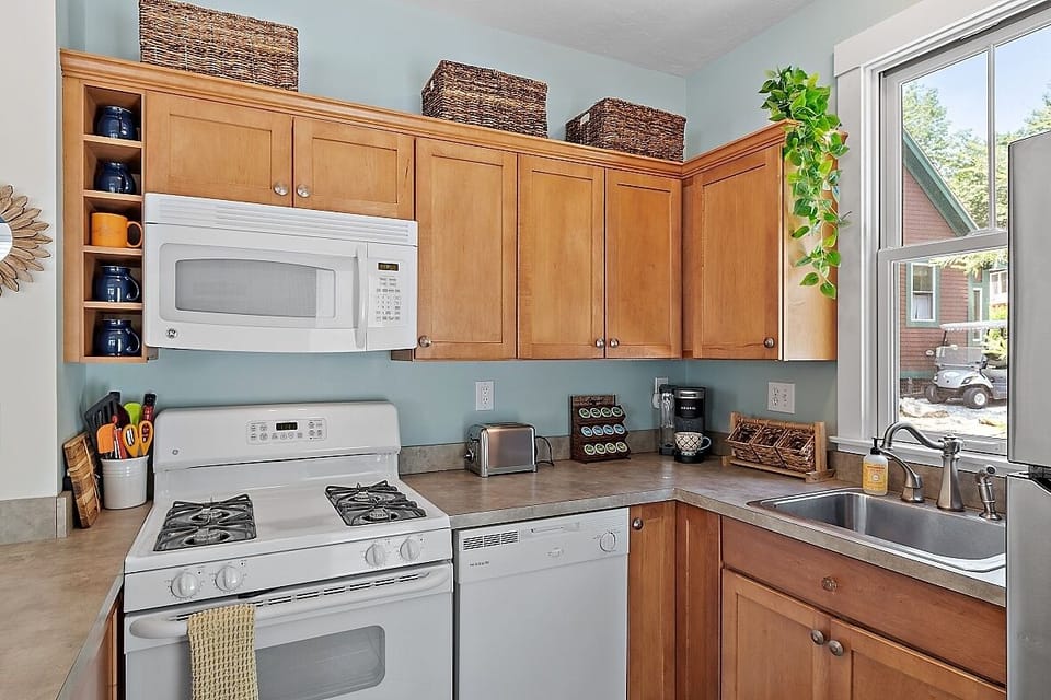 Kitchen with Keurig coffee maker and some K-cup pods to get you started.