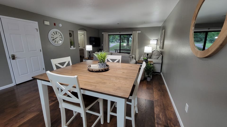 dining table with 4 chairs and 4 extra seats can be added to seat 8