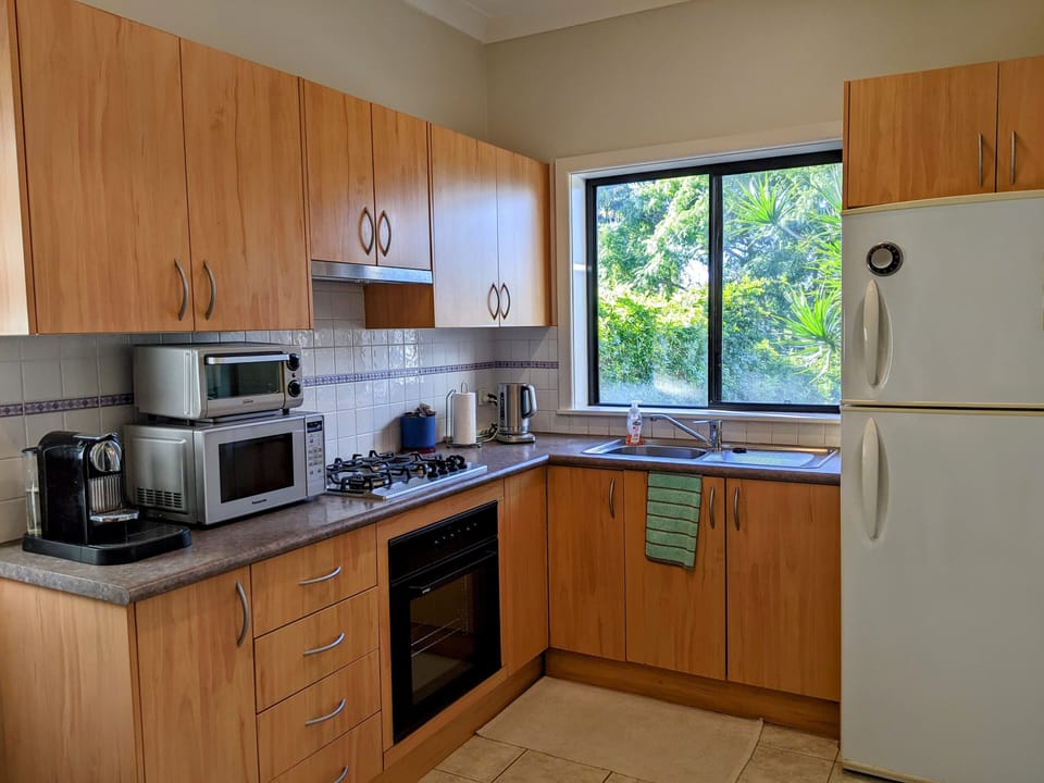 Full kitchen with all appliances pictured