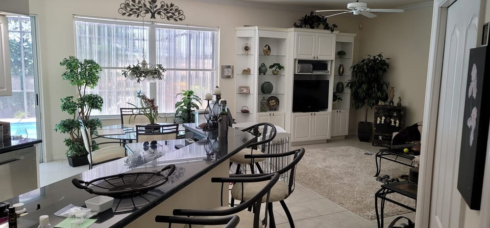 Full breakfast bar and table and chairs off the pool and lanai.