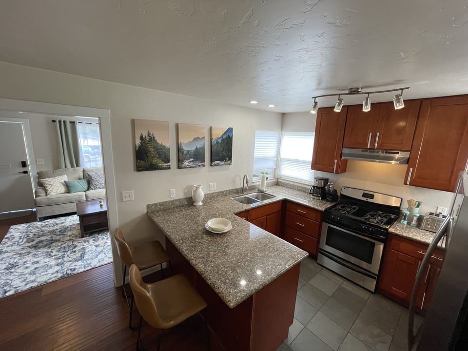 Granite counters in the fully stocked kitchen Ice maker gas stove and dishwasher