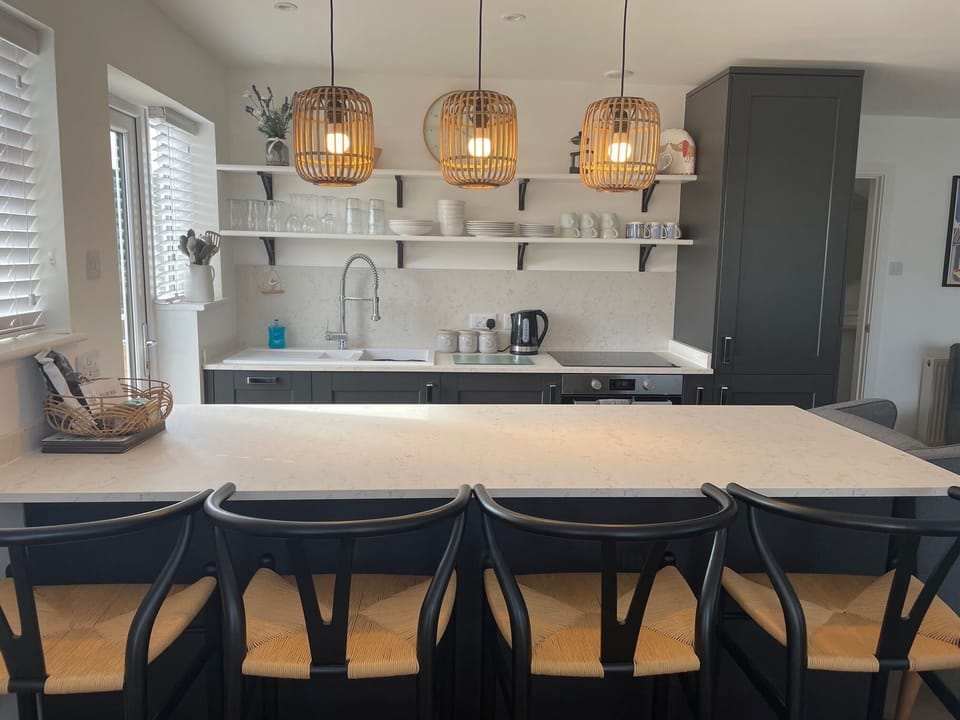 Large breakfast bar with comfy bar stools