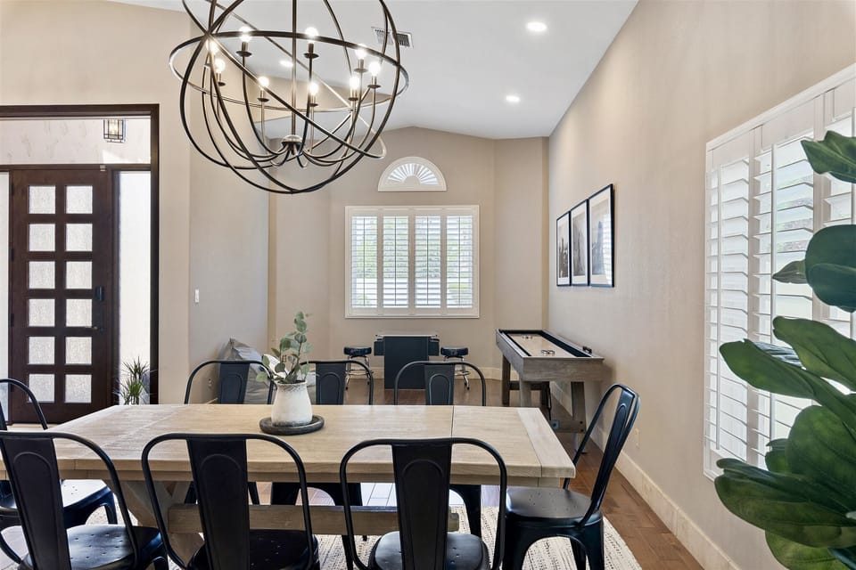 Well lit entryway opens to game room and dining area. 