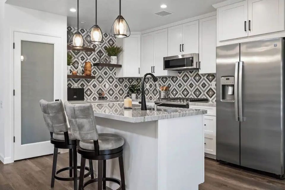 Kitchen with lots of counter space, high end cookware and utensils 